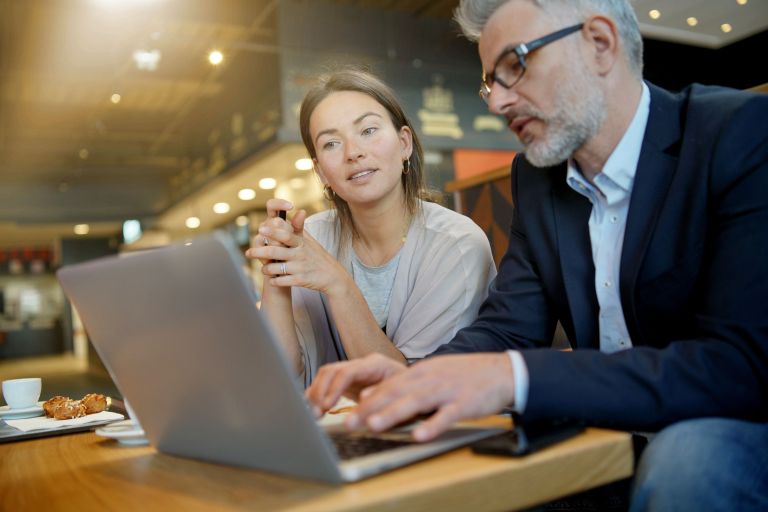 Informal meeting between salesman and manager in modern work space